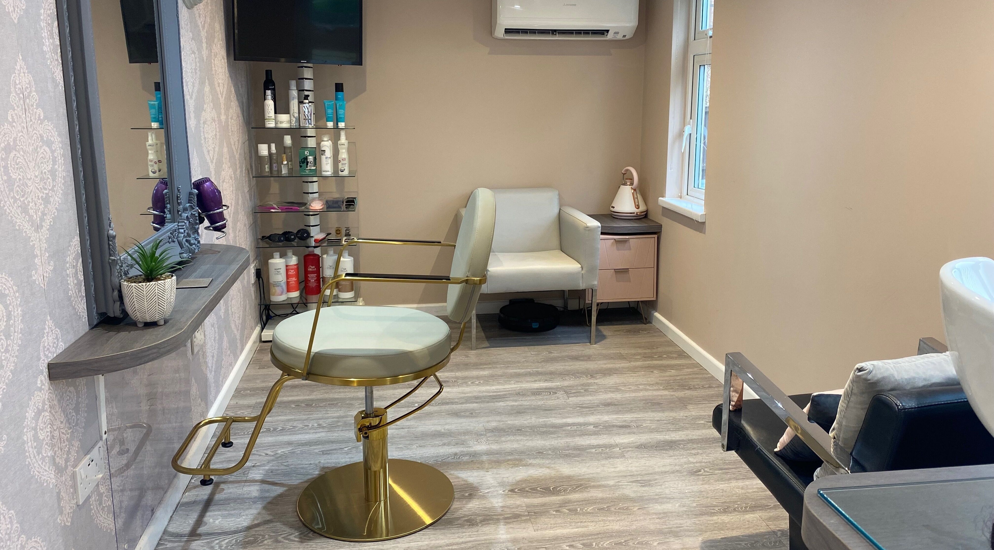 Luxury salon interior at Hair Therapy, Stockton Brook, England, GB showcasing a vintage-style chair and decor.