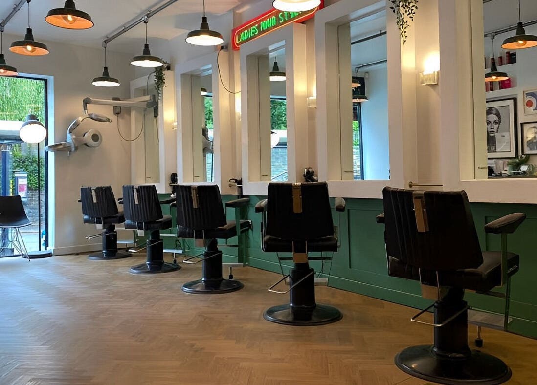 Chic salon interior at Jam, featuring modern styling stations in Sheffield, England, GB.