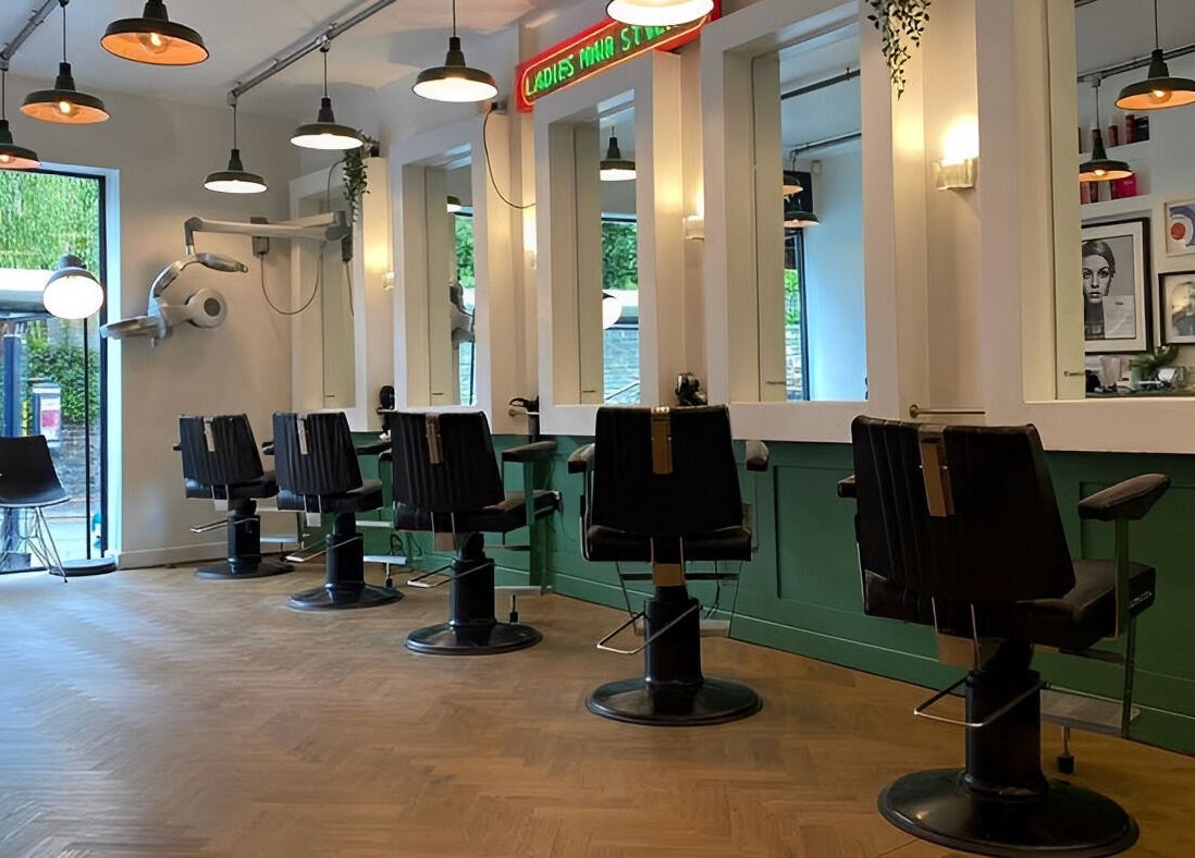 Chic salon interior at Jam, featuring modern styling stations in Sheffield, England, GB.