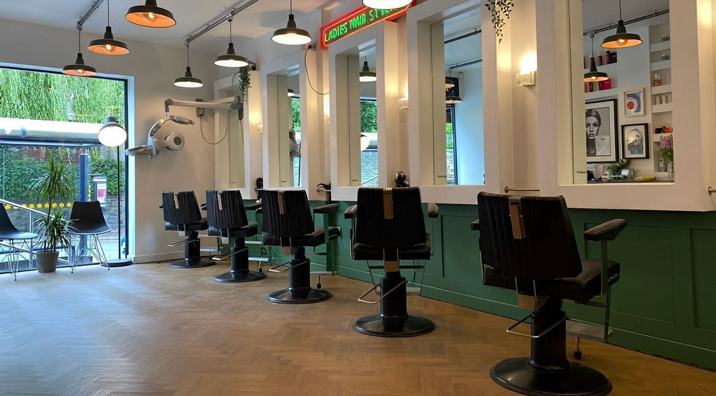 Chic salon interior at Jam, featuring modern styling stations in Sheffield, England, GB.