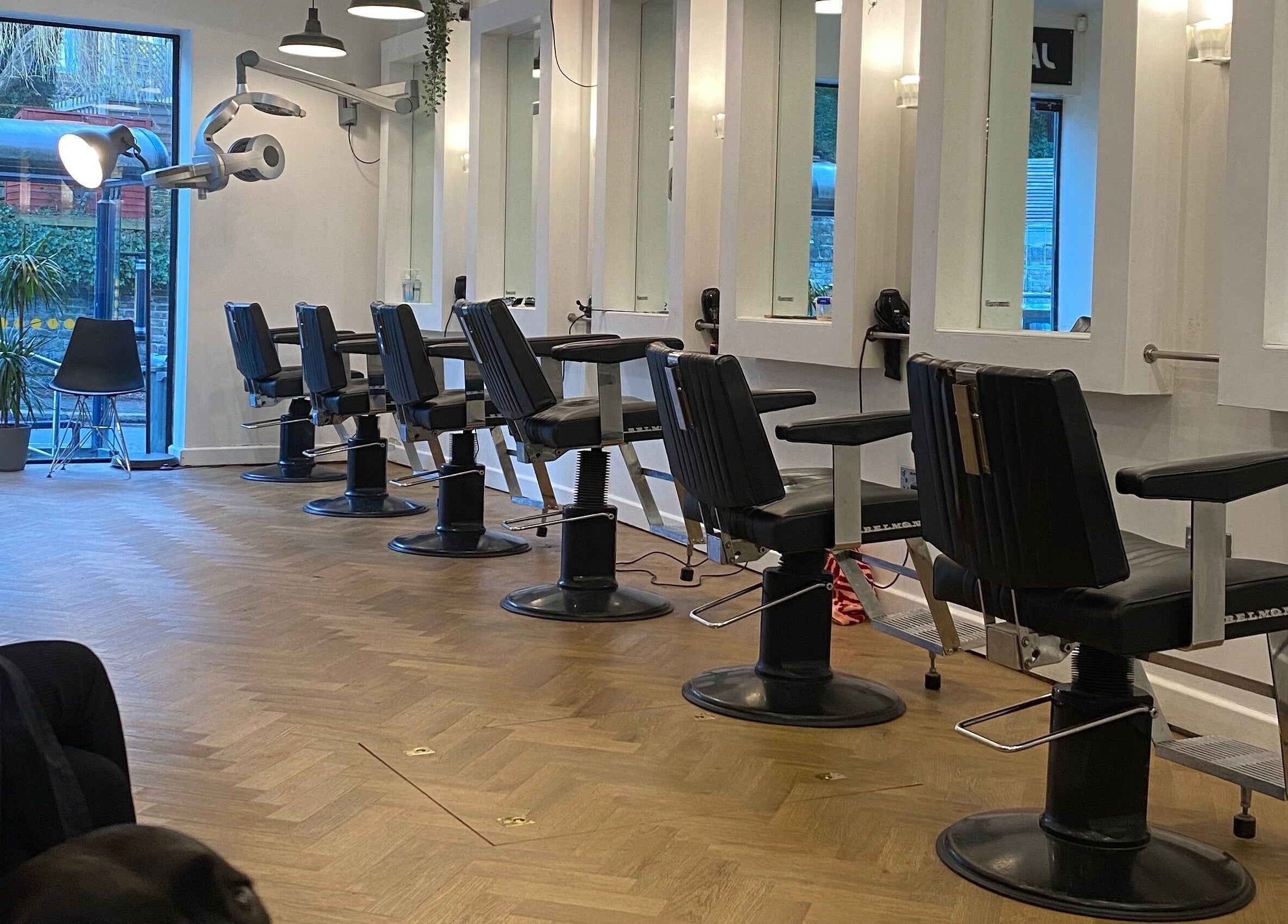Modern hair salon chairs inside Jam, a beauty venue in Sheffield, England, GB.