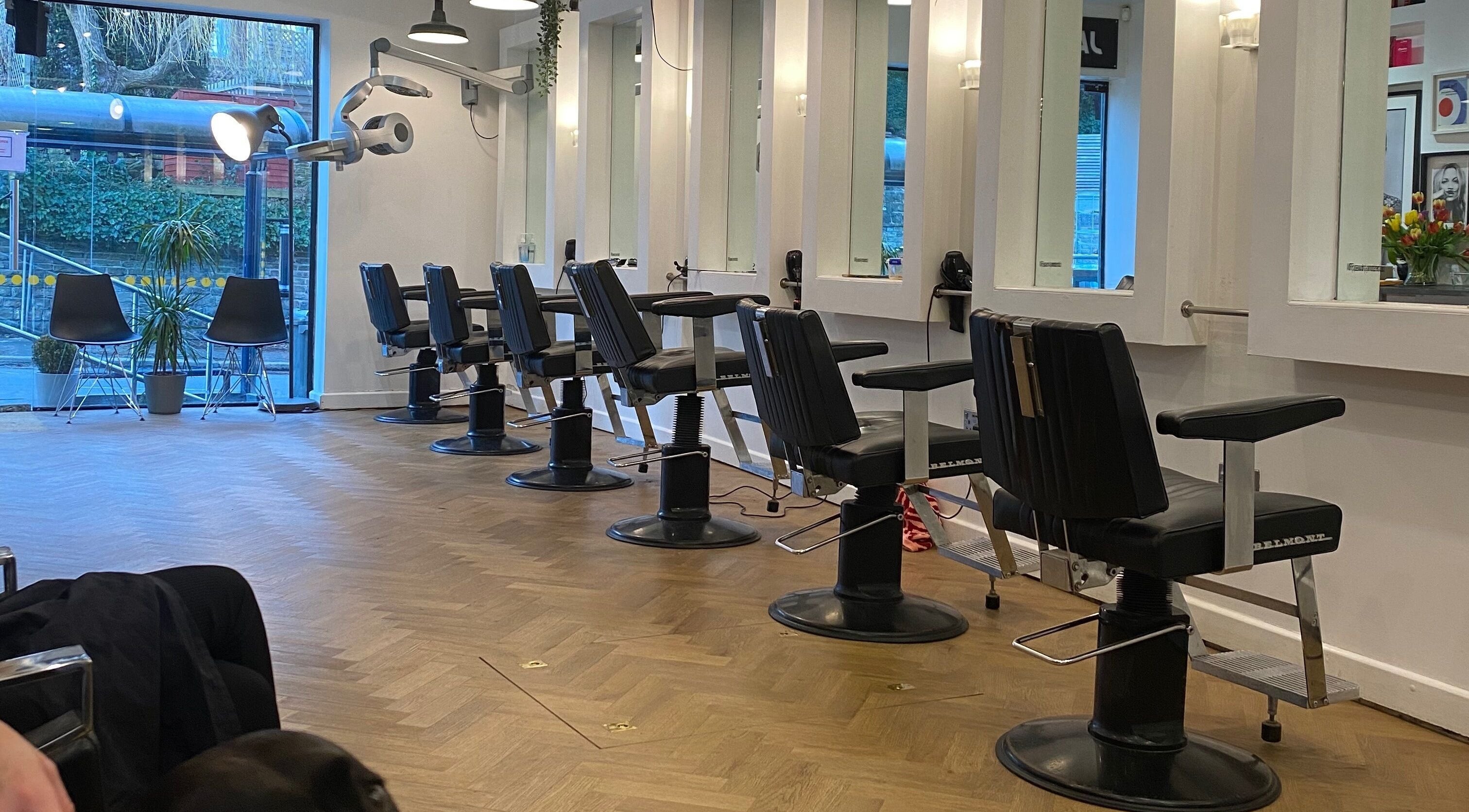 Modern hair salon chairs inside Jam, a beauty venue in Sheffield, England, GB.