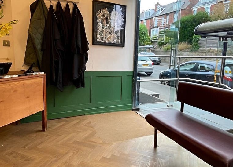 Welcoming entrance of Jam with a bench and decor, located in Sheffield, England, GB.