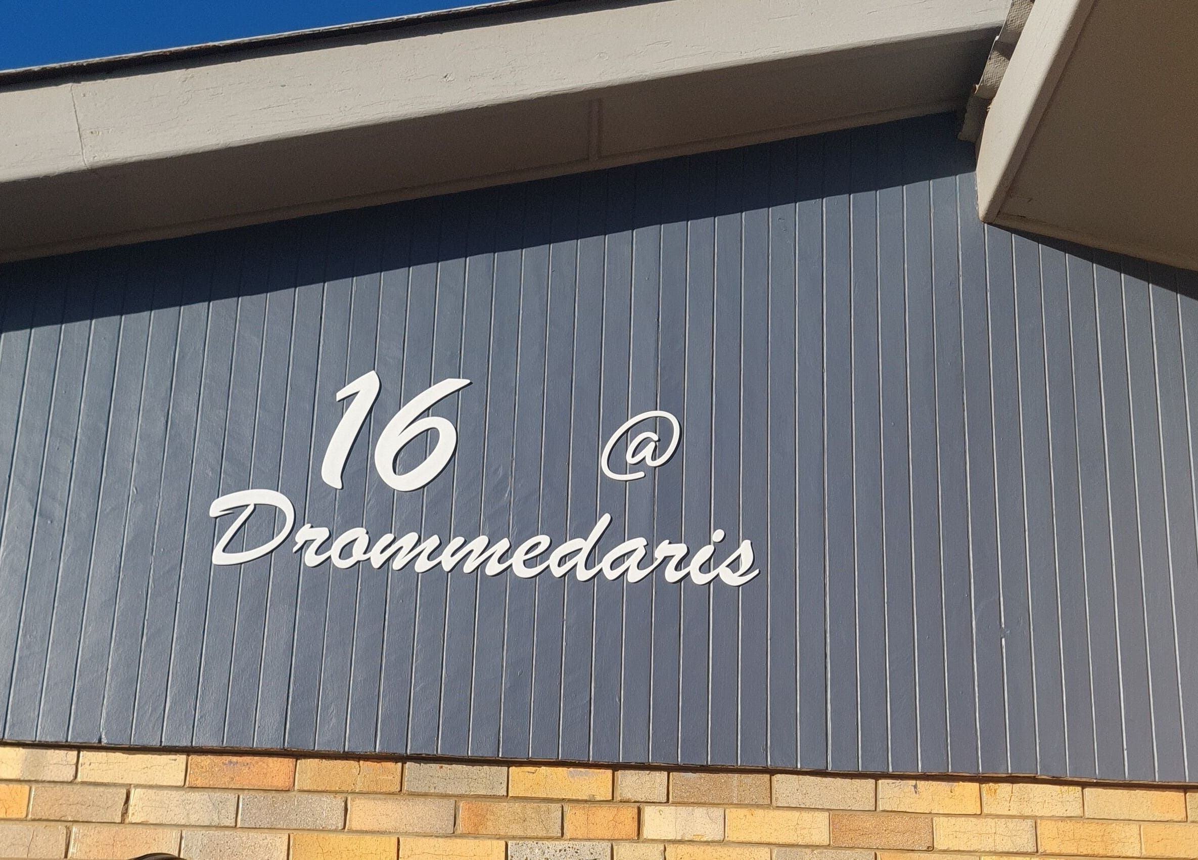 Exterior wall displaying unit 16 at Drommedaris, near Beauty Secrets, Jeffreys Bay, Eastern Cape, ZA.