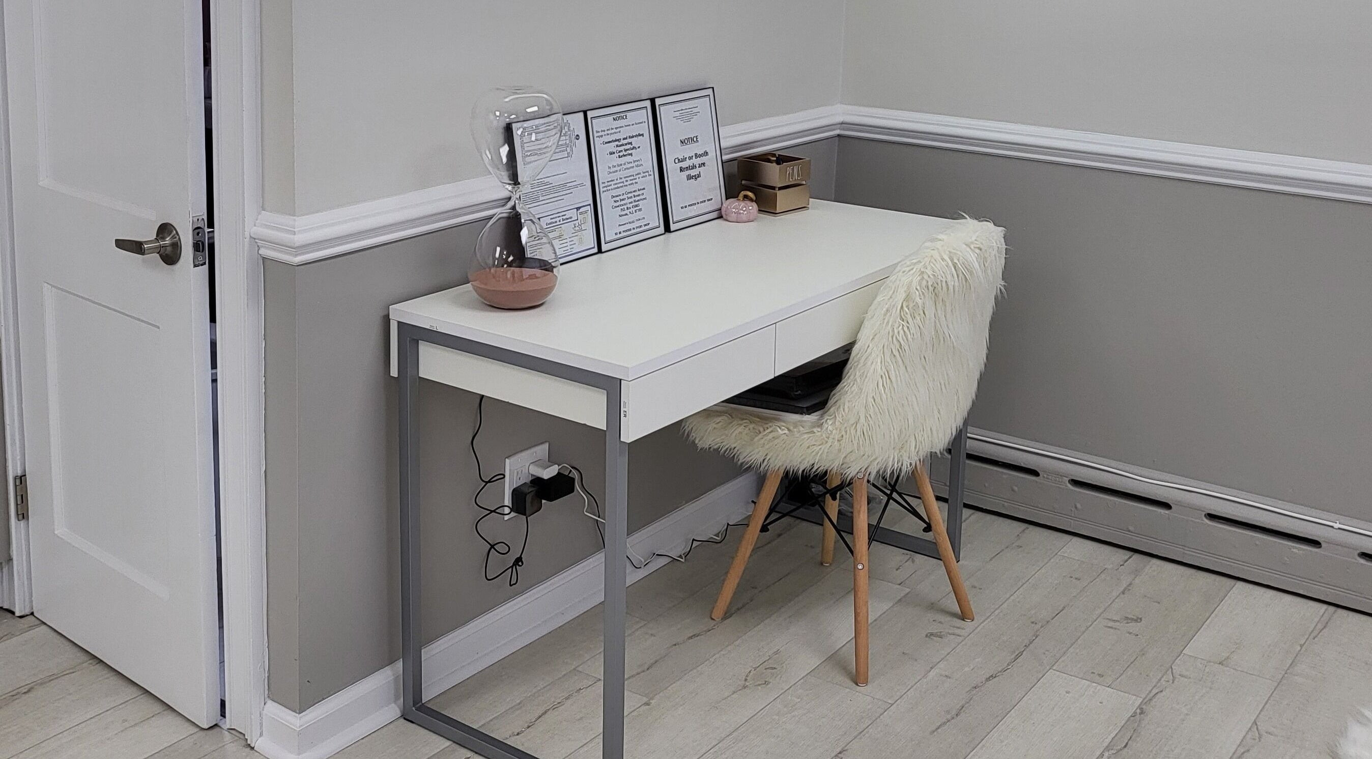 Modern desk at JQ The Salon, Stanhope, New Jersey, US, ideal for a serene beauty experience.