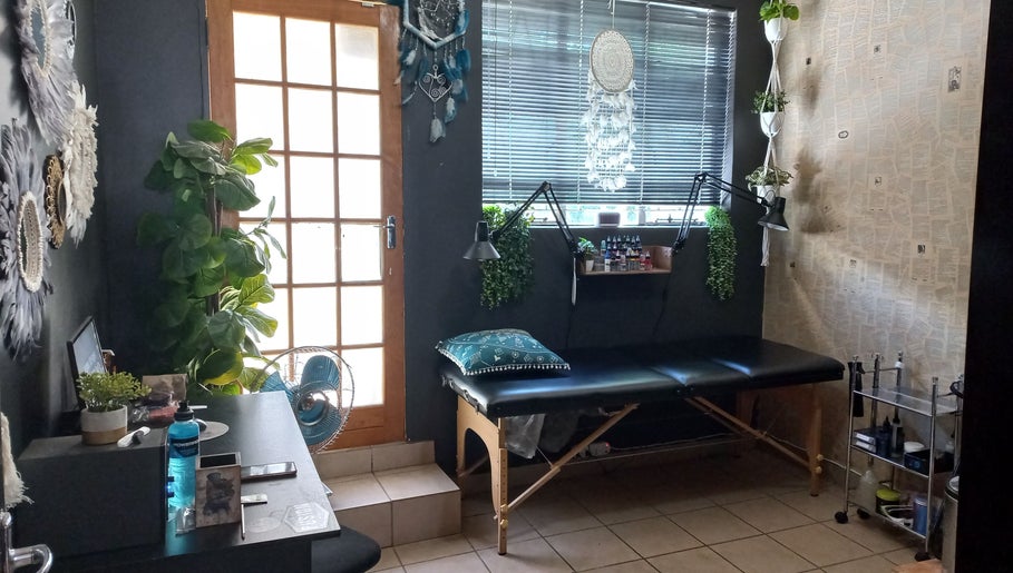 Cozy interior of Dare to Ink Tattoo Studio in Bloemfontein, Free State, ZA with comfortable seating and decor.