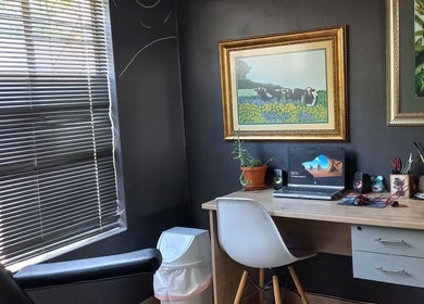 Cozy workspace at Dare to Ink Tattoo Studio, Bloemfontein, Free State, ZA featuring artistic wall decor.