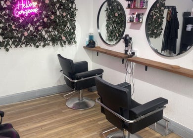 Chic salon interior with mirrors and seats at Klg Nails & Beauty, Tyldesley, England, GB.