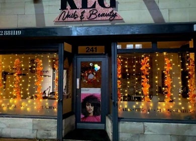 Festive lights illuminate Klg Nails & Beauty facade in Tyldesley, England, GB.