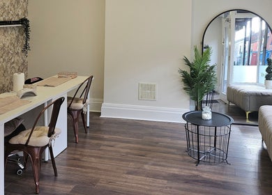 Sleek interior of Klg Nails & Beauty in Tyldesley, England, GB with chic nail stations and cozy seating.