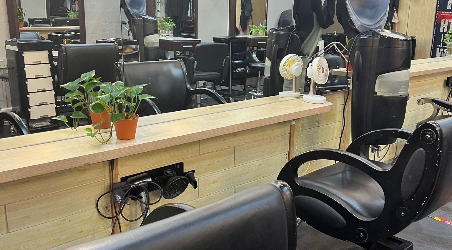 Raven Bey salon interior with sleek black chairs @ Orchard, Singapore, Singapore, SG – Korean C Curl & Perm Specialist.