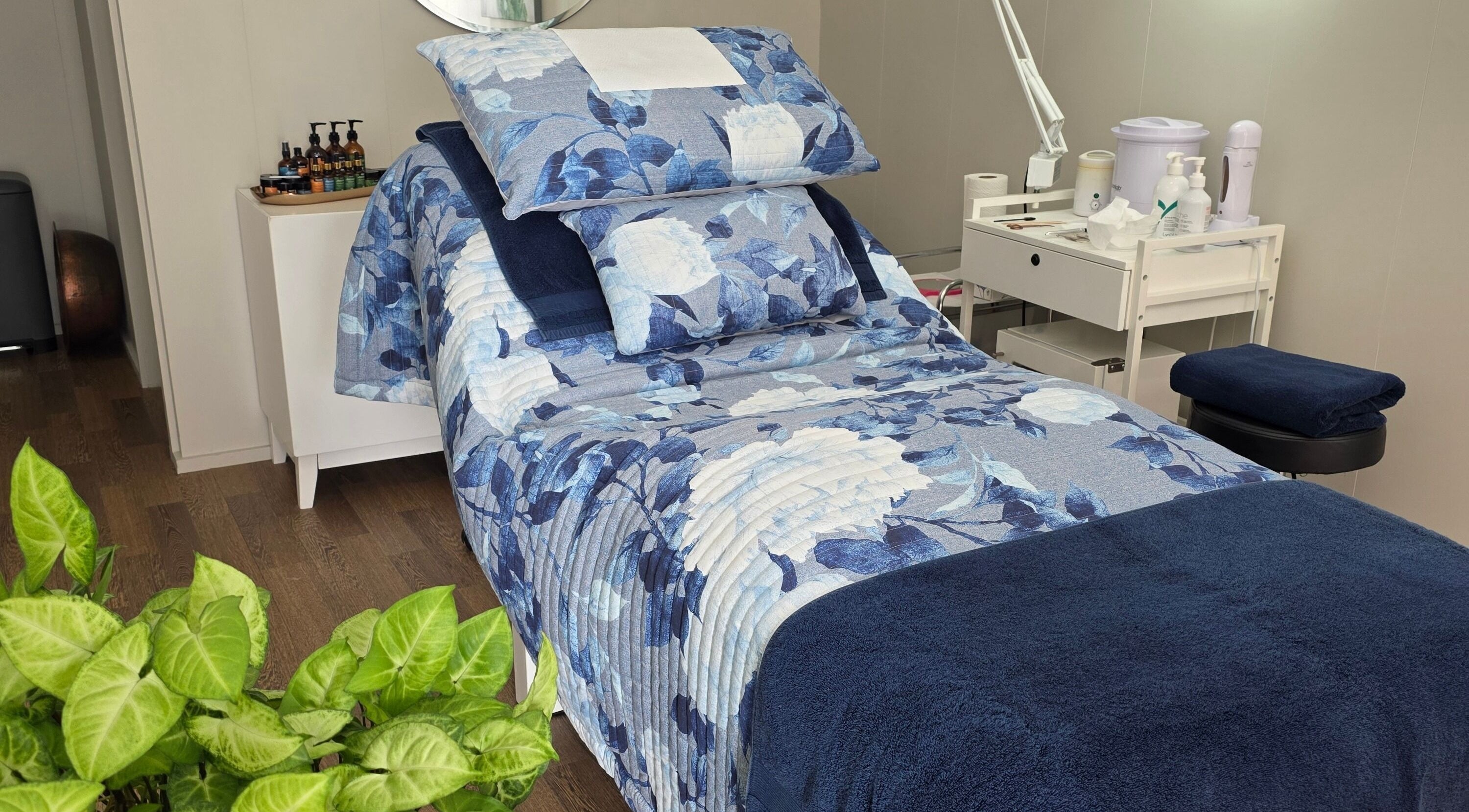 Comfortable floral treatment bed at Beauty by Tania in Auckland, Auckland, NZ with calming decor.