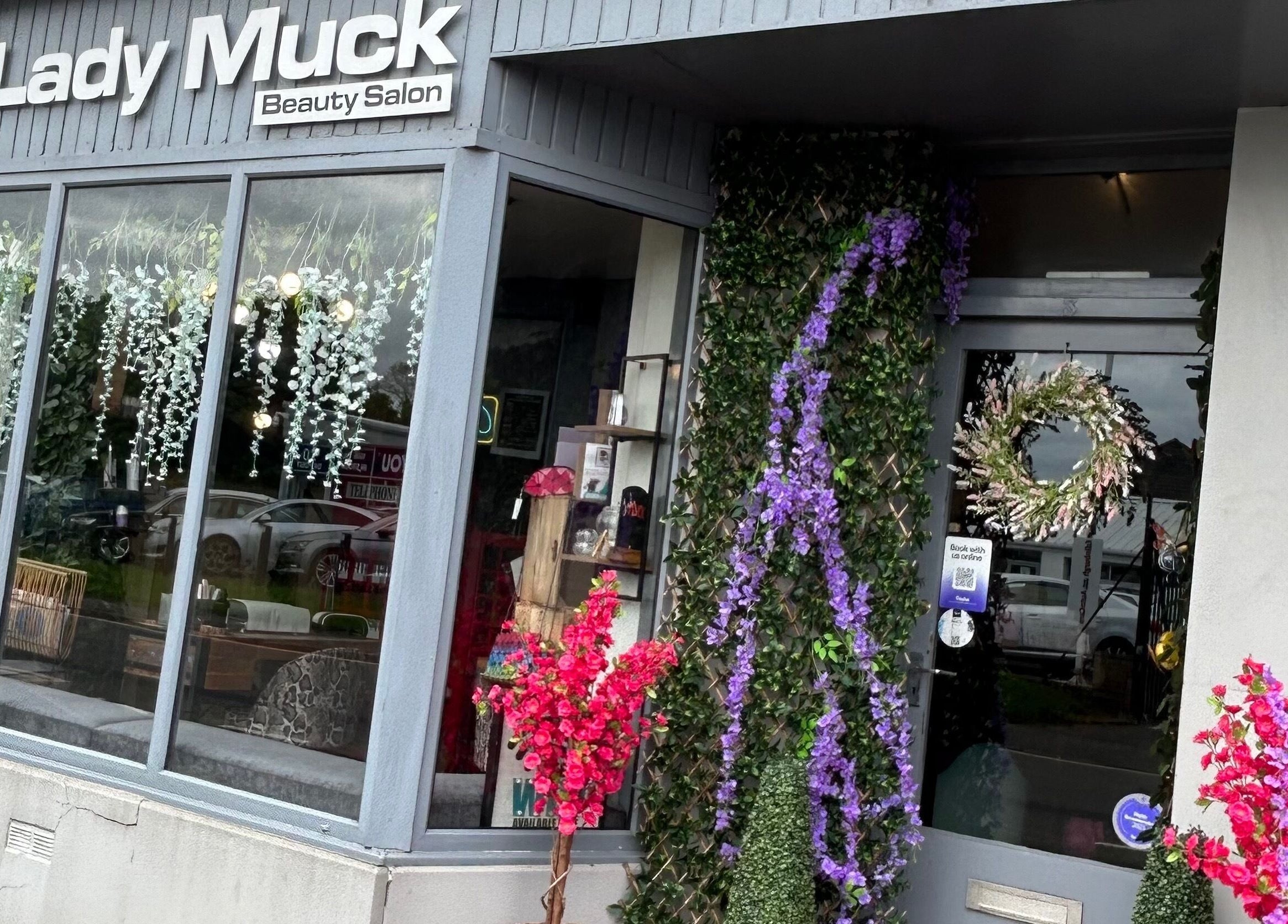 Lady Muck, Bilston entrance adorned with floral decor, located in Bilston, Scotland, GB.