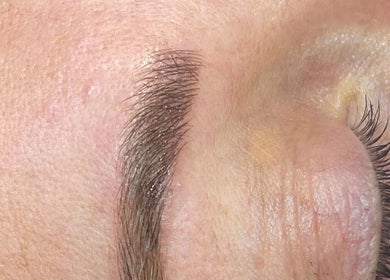 Close-up of expertly shaped eyebrow at SC Aesthetics, Ayr, Scotland, GB, showcasing precision and care.