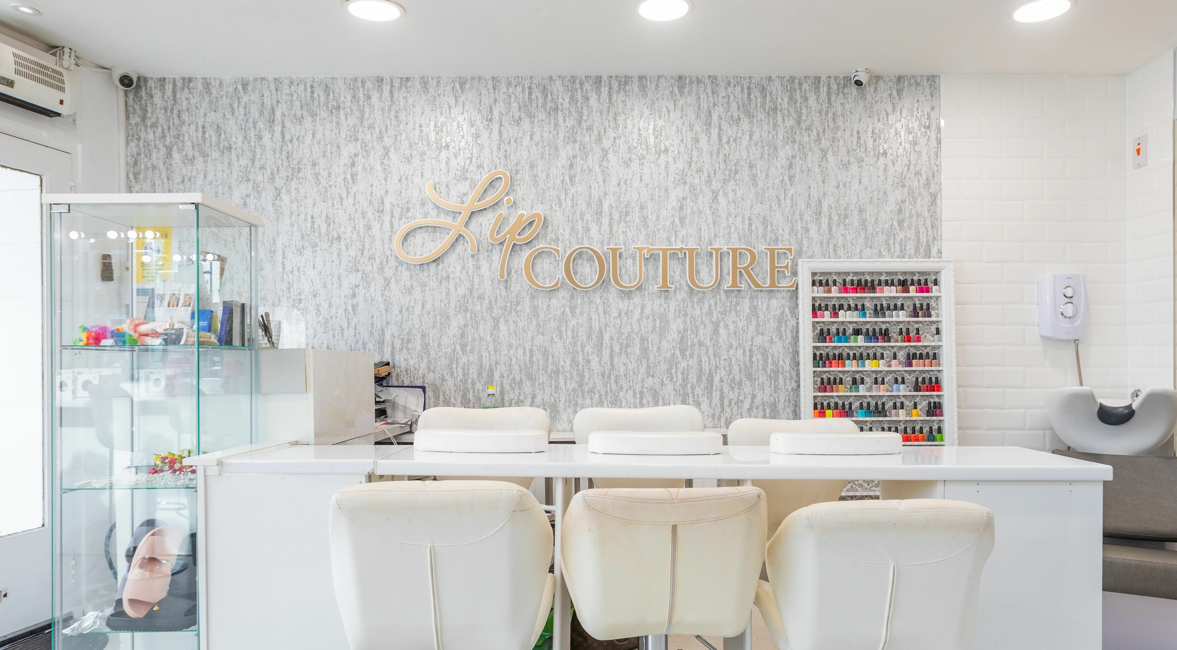 Sophisticated manicure station at Lipcouture, Waterloo, England, GB showcasing modern design and nail color display.