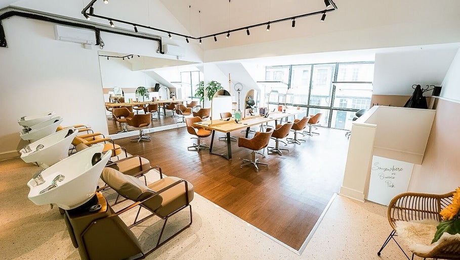 Contemporary salon interior at Somewhere in Queens Park, London, England, GB with chic styling areas.