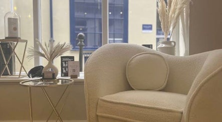 Elegant lounge area at Alex @ Jazmine Love hair in Carmarthen, Wales, GB featuring plush seating and decor.