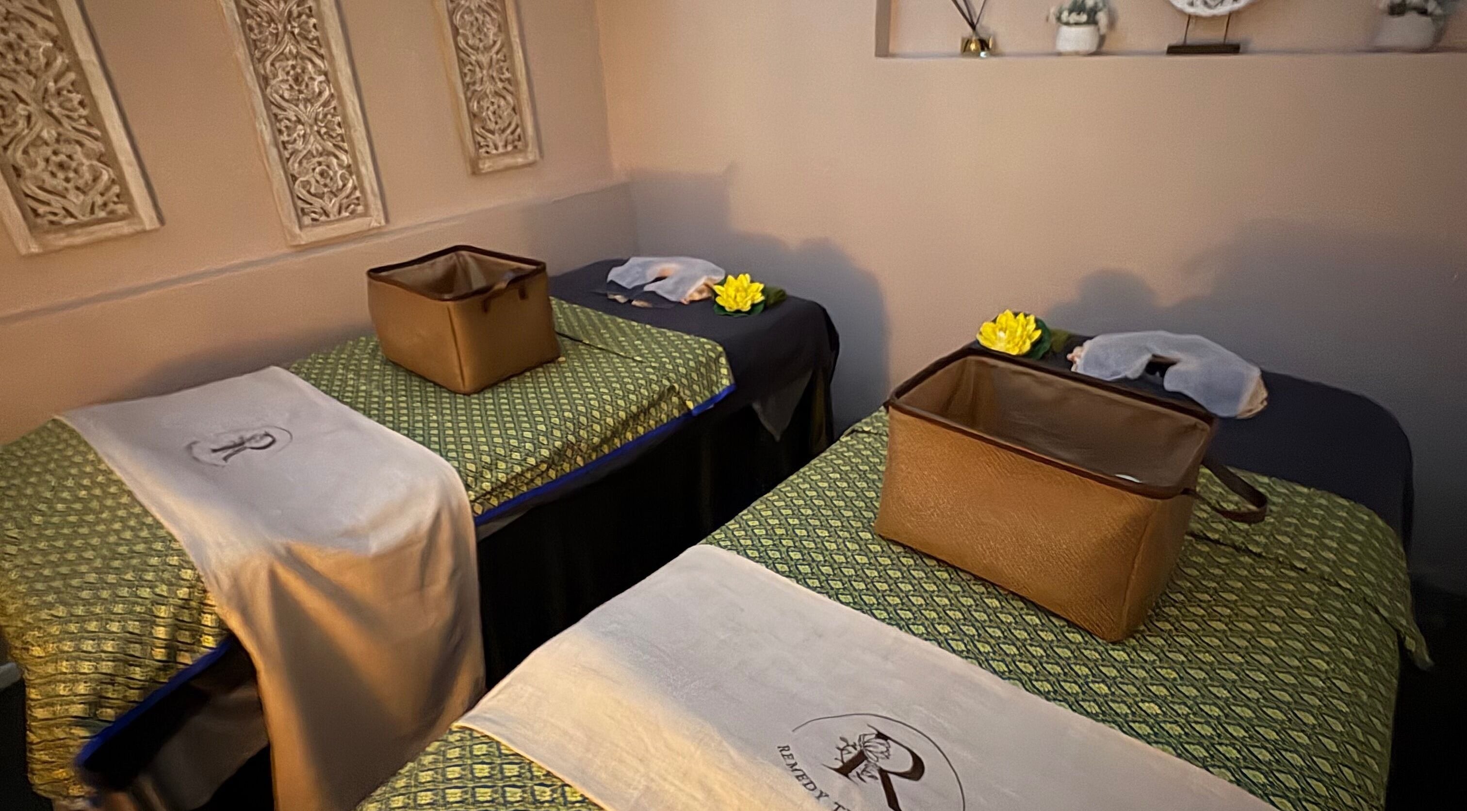 Cozy massage room at Remedy Thai Massage and Spa in Auckland, Auckland, NZ with two inviting treatment beds.