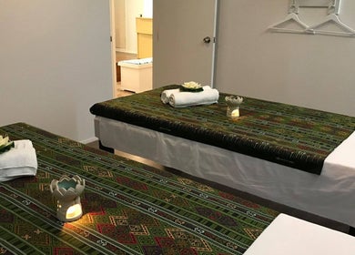 Relaxing massage room at Remedy Thai Massage and Spa in Auckland, NZ, with calm ambiance and traditional decor.
