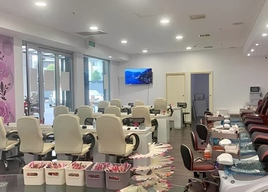 Interior of Findon Nails and Spa at Findon Shopping Centre COLES, featuring modern seating and rose decor.
