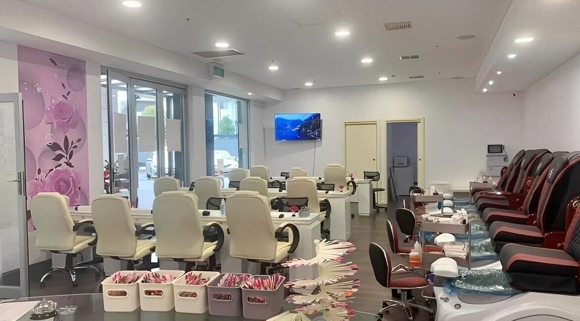 Interior of Findon Nails and Spa at Findon Shopping Centre COLES, featuring modern seating and rose decor.