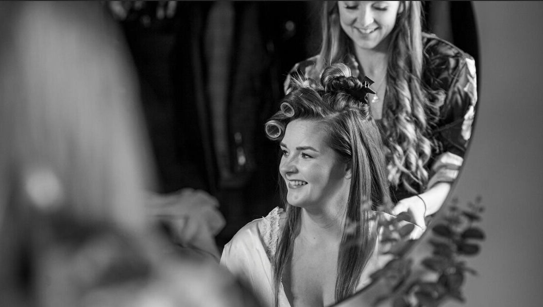 Stylist at Hair by Tamiyya in Reading, England, GB, creating a joyful salon experience with happy client.