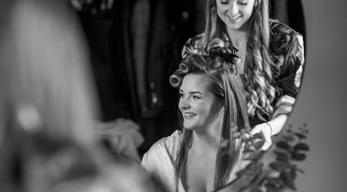 Stylist at Hair by Tamiyya in Reading, England, GB, creating a joyful salon experience with happy client.