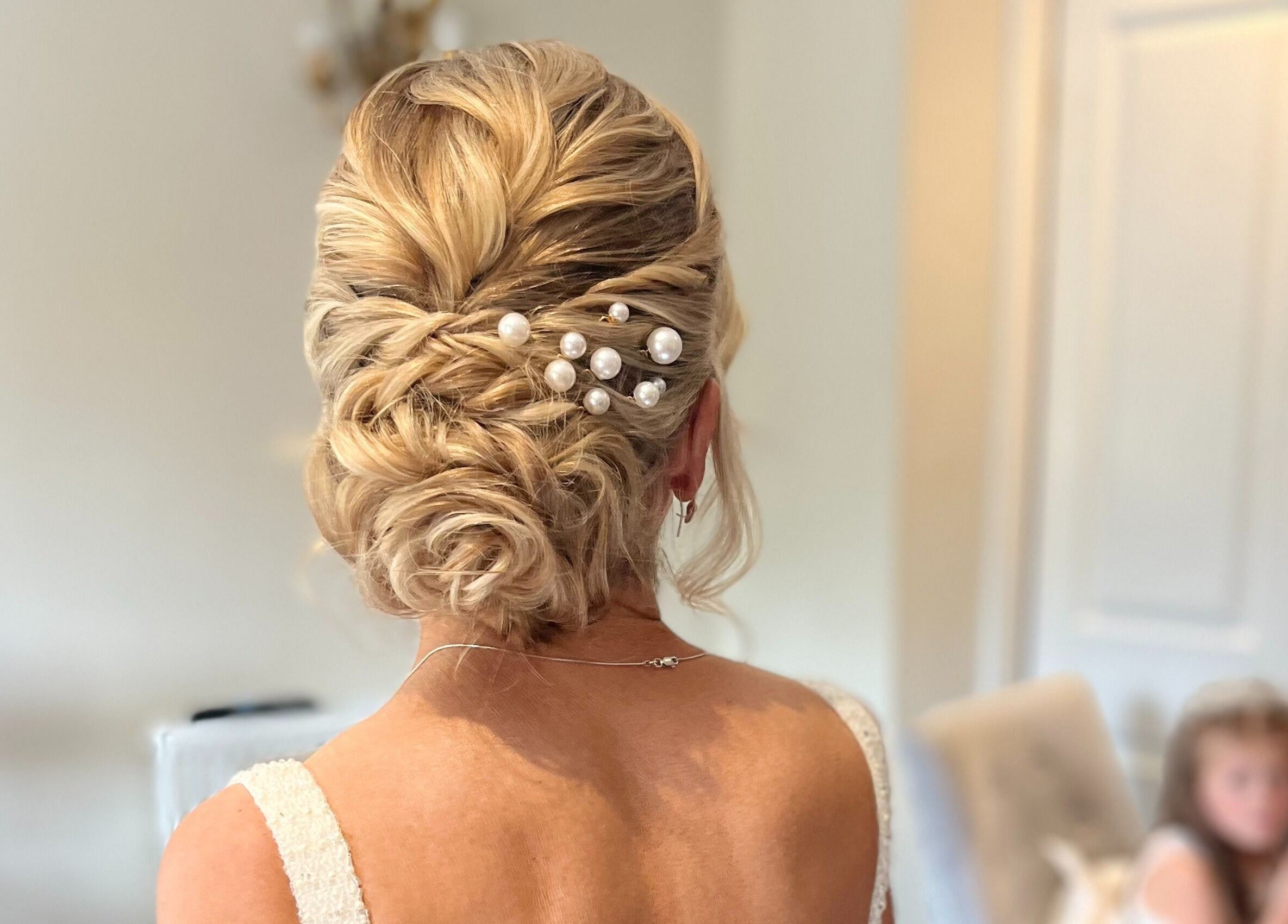 Elegant bridal hairstyle with pearls at Hair by Tamiyya in Reading, England, GB.