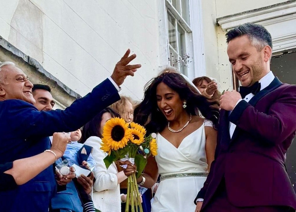 Wedding celebration at Hair by Tamiyya, Reading, England, GB with smiling couple and guests.