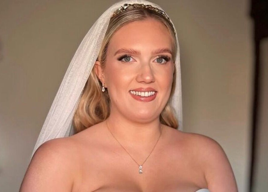 Smiling bride with elegant hairstyle at Hair by Tamiyya, Reading, England, GB.