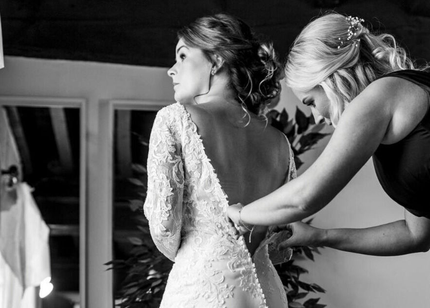 Bride getting ready for wedding at Hair by Tamiyya, Reading, England, GB.