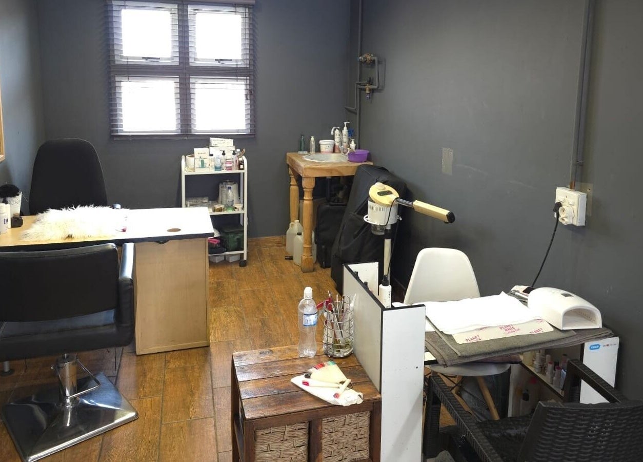 Modern beauty salon interior at Manetain, Pretoria, Gauteng, ZA with sleek design and cozy workspace.