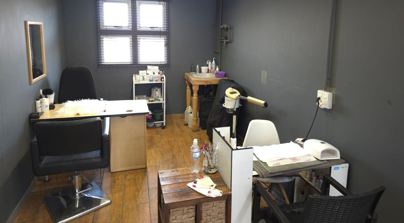 Modern beauty salon interior at Manetain, Pretoria, Gauteng, ZA with sleek design and cozy workspace.