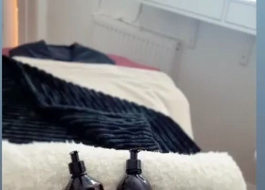 Relaxing massage table setup at Beauty by Jayde, Mauchline, Scotland, GB, featuring elegant black linens.