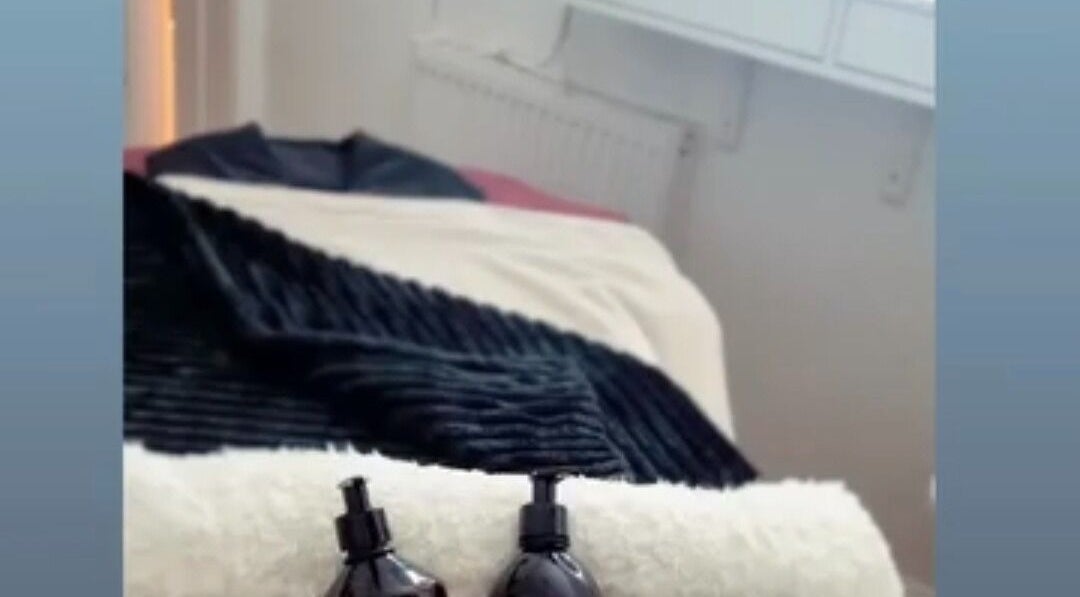 Relaxing massage table setup at Beauty by Jayde, Mauchline, Scotland, GB, featuring elegant black linens.