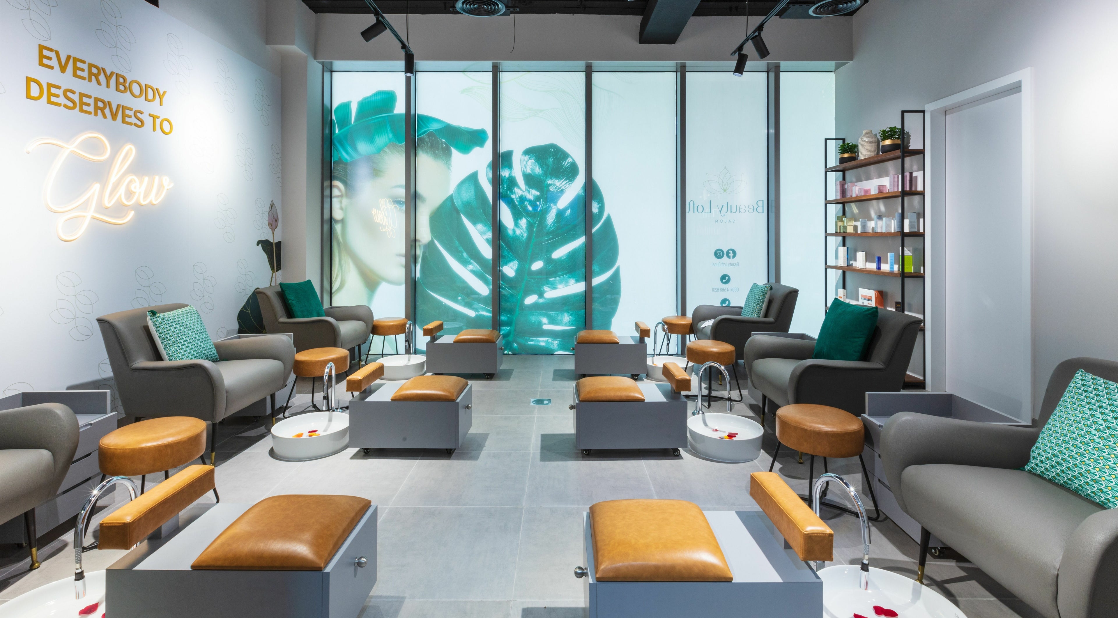Chic seating area at Beauty Loft Salon in Dubai, AE, featuring stylish chairs and pedicure stations.