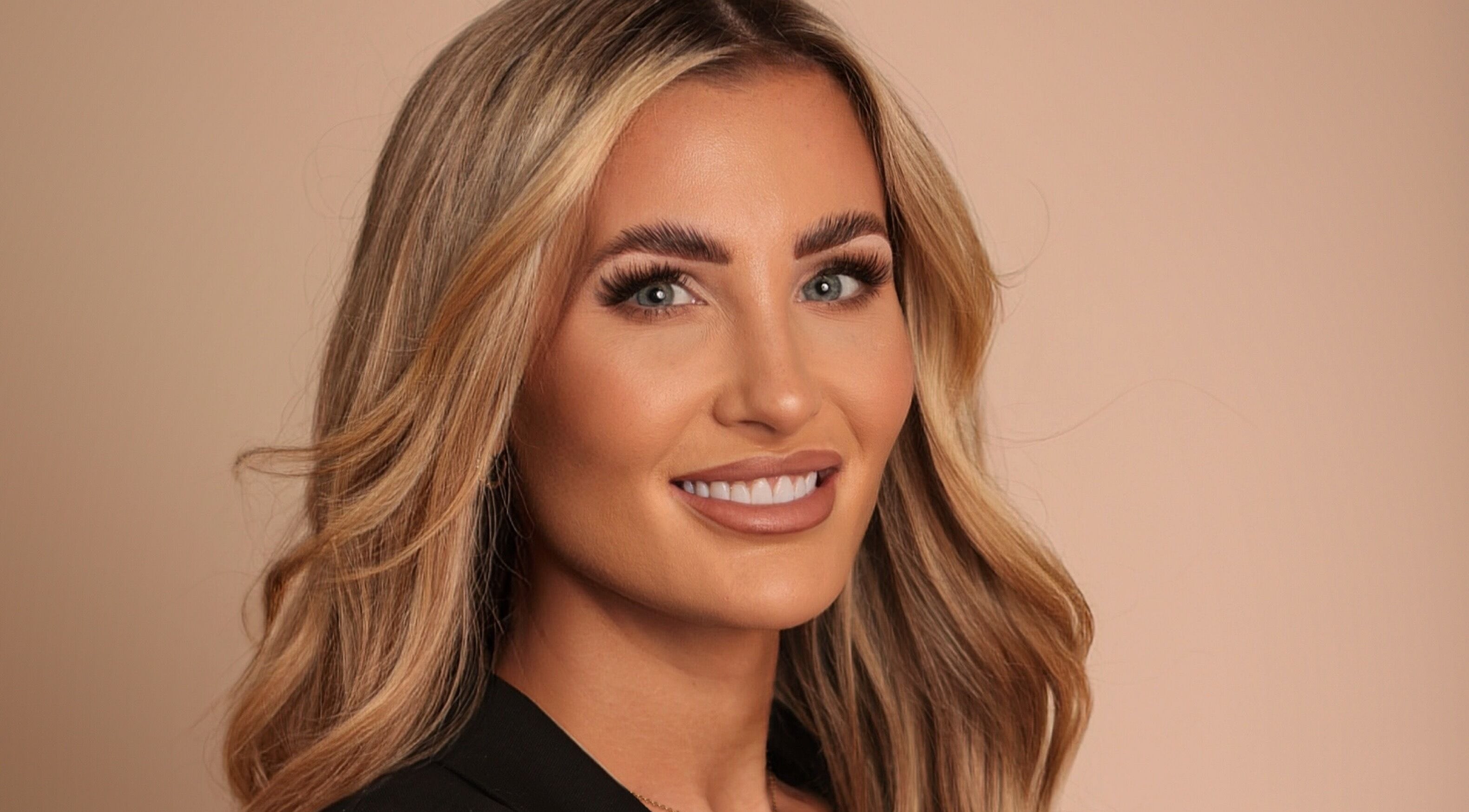 Smiling woman with styled blonde hair captured at LIV Aesthetics - Brow and Co Shipley, Shipley, England, GB.