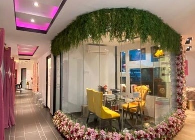 Elegant interior of Sweet Pinky Beauty House in KUALA TERENGGANU, TERENGGANU, MY with floral decor and seating.