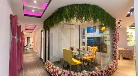 Elegant interior of Sweet Pinky Beauty House in KUALA TERENGGANU, TERENGGANU, MY with floral decor and seating.