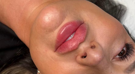 Close-up of radiant lips with lash extensions at Profile by Leanne, Basingstoke, England, GB.