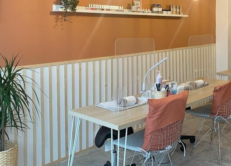 Modern nail studio at Un|Basic, London, England, GB with stylish decor and comfortable seating.