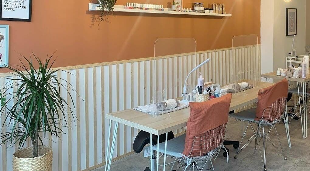 Modern nail studio at Un|Basic, London, England, GB with stylish decor and comfortable seating.