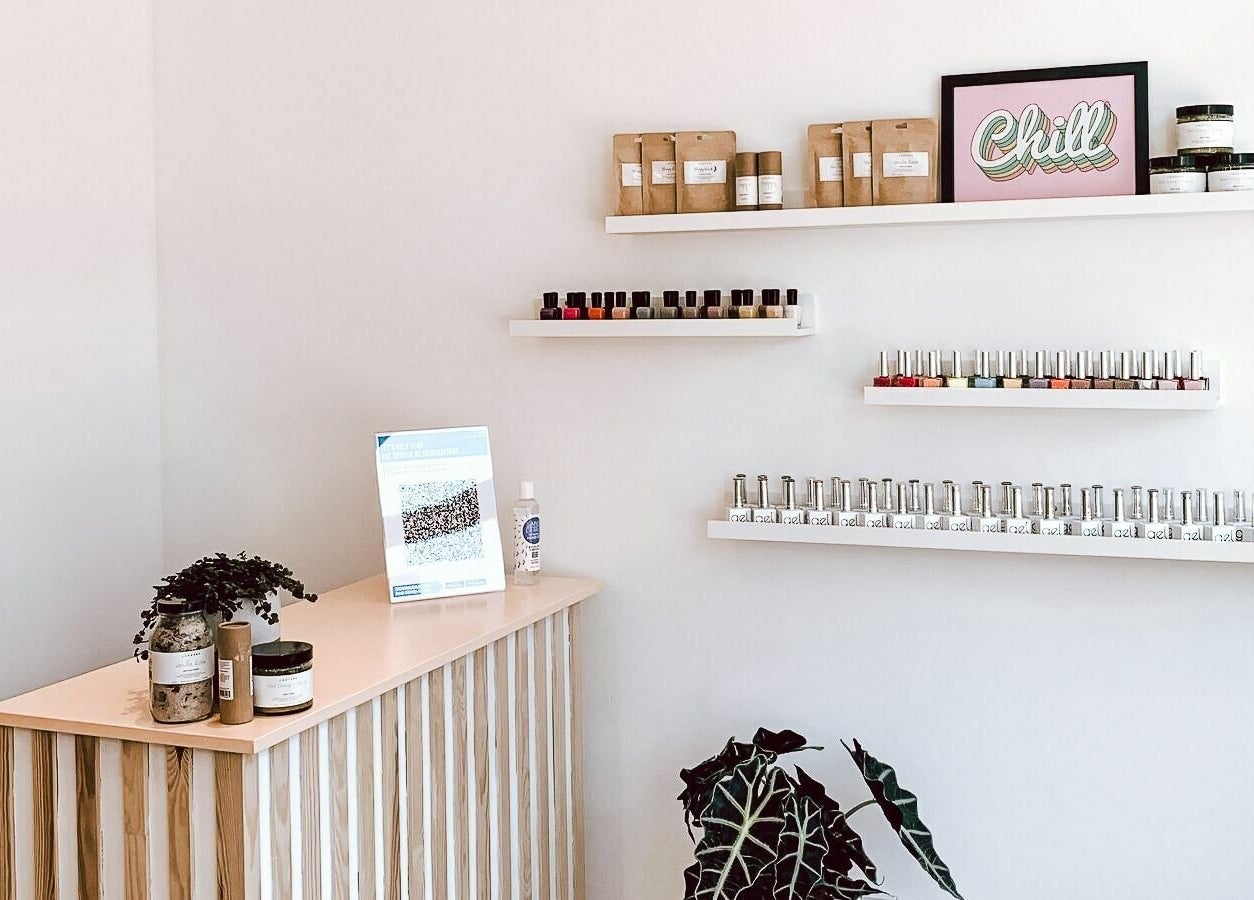 Un|Basic nail polish display in London, England, GB, featuring shelves with vibrant colors and a relaxing ambiance.
