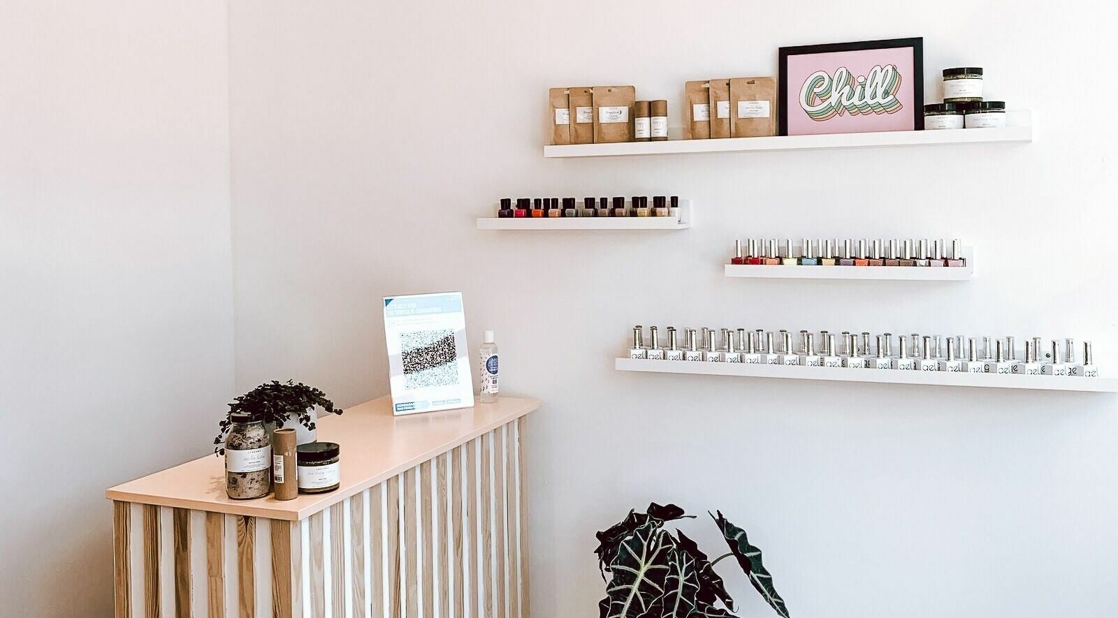 Un|Basic nail polish display in London, England, GB, featuring shelves with vibrant colors and a relaxing ambiance.