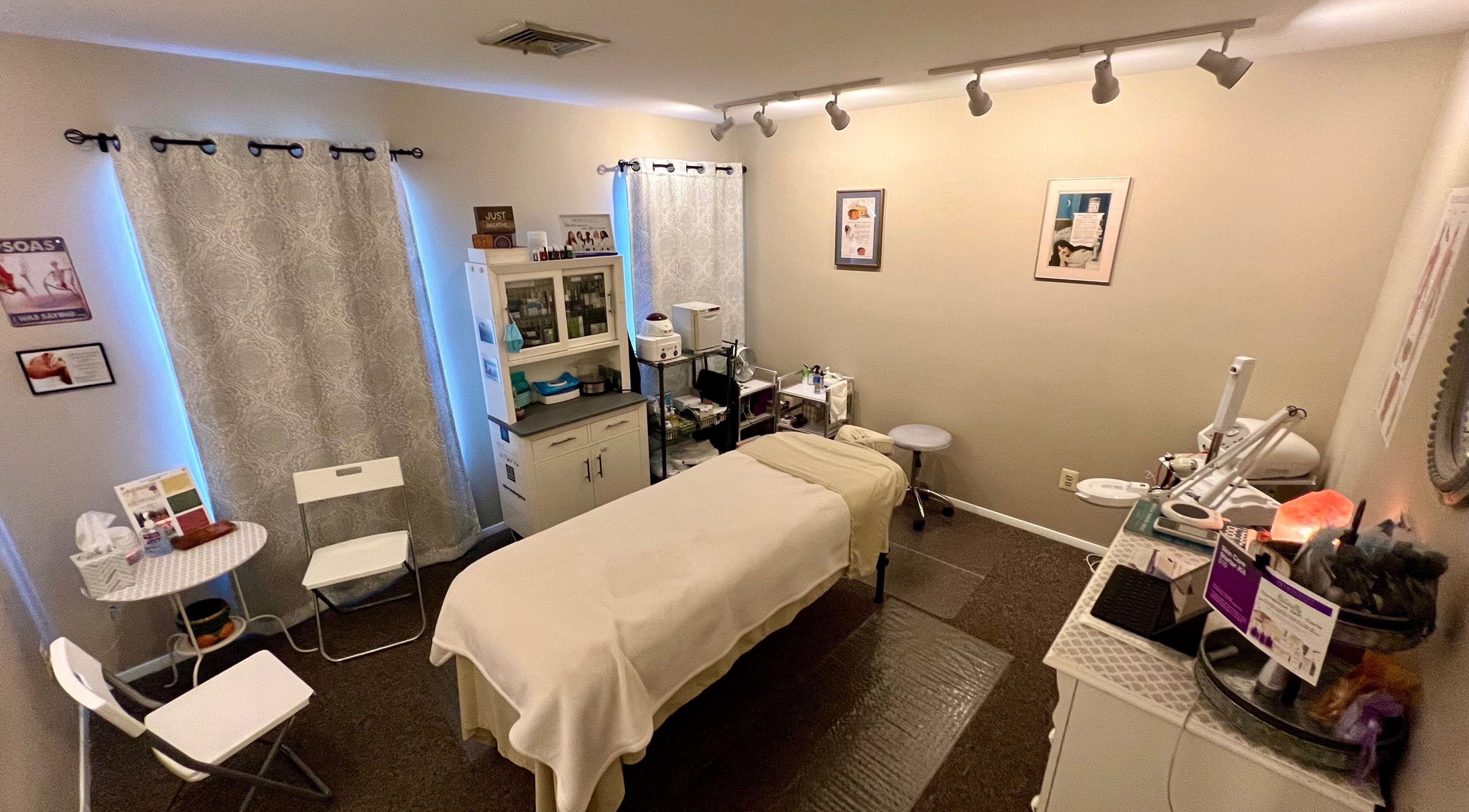 Earth Beauty Essentials, LLC in Flemington, New Jersey, US: serene spa room with massage table and essential oils.