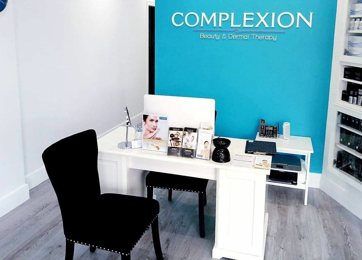 Reception area at Complexion Skin Clinic, Mitcham, Victoria, AU, featuring modern decor and skincare displays.