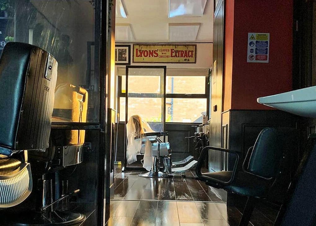 Cozy interior of John at Mulholland Barbering in Portadown, Northern Ireland, GB featuring vintage decor.