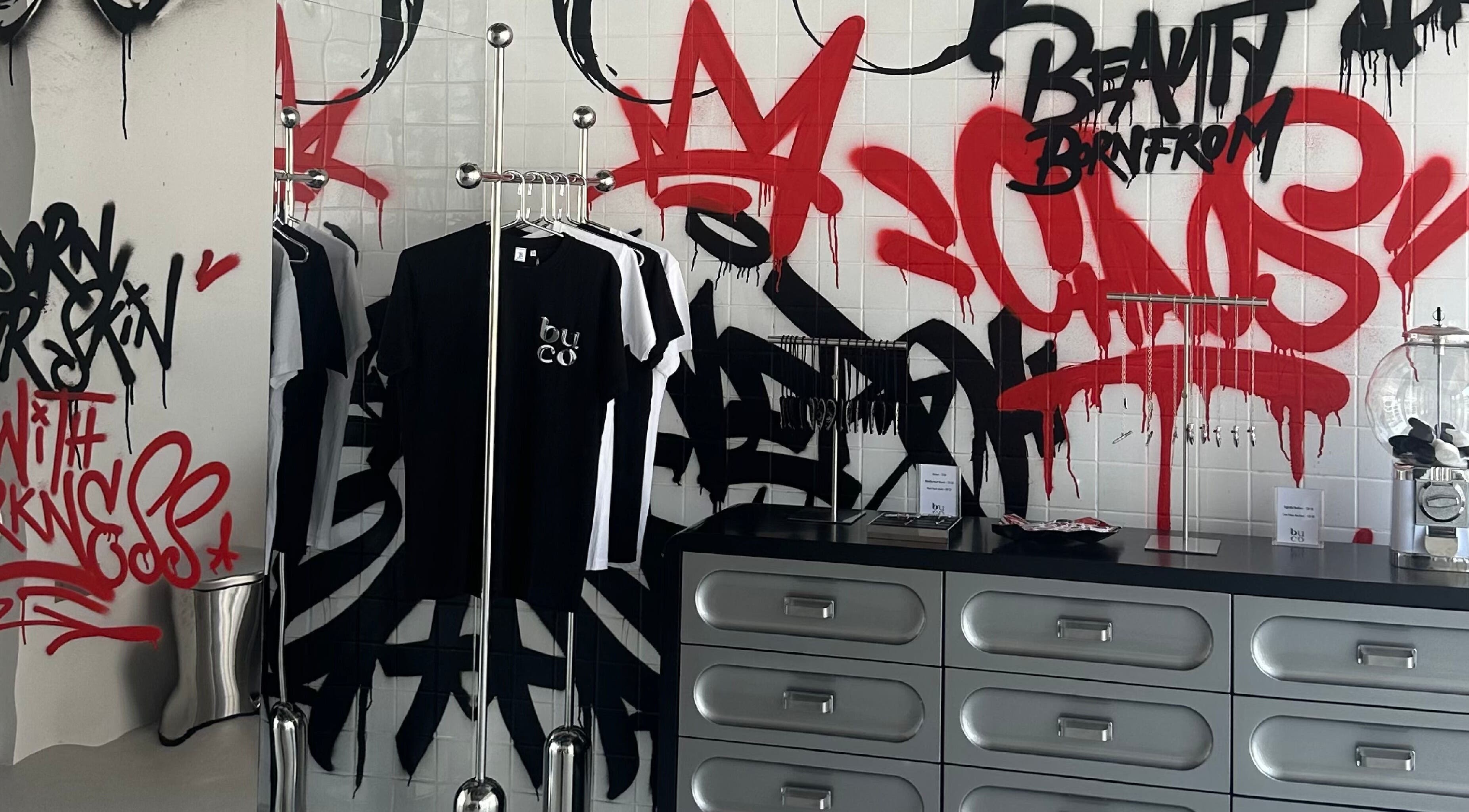 Buco Piercing Parlor in Doha, Doha, QA, showcasing graffiti art and modern interior design.