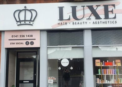 Front view of Luxe Hair Beauty Aesthetics in Glasgow, Scotland, GB showcasing stylish window displays.