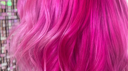 Vibrant pink hair styled at Luxe Hair Beauty Aesthetics, Glasgow, Scotland, GB.